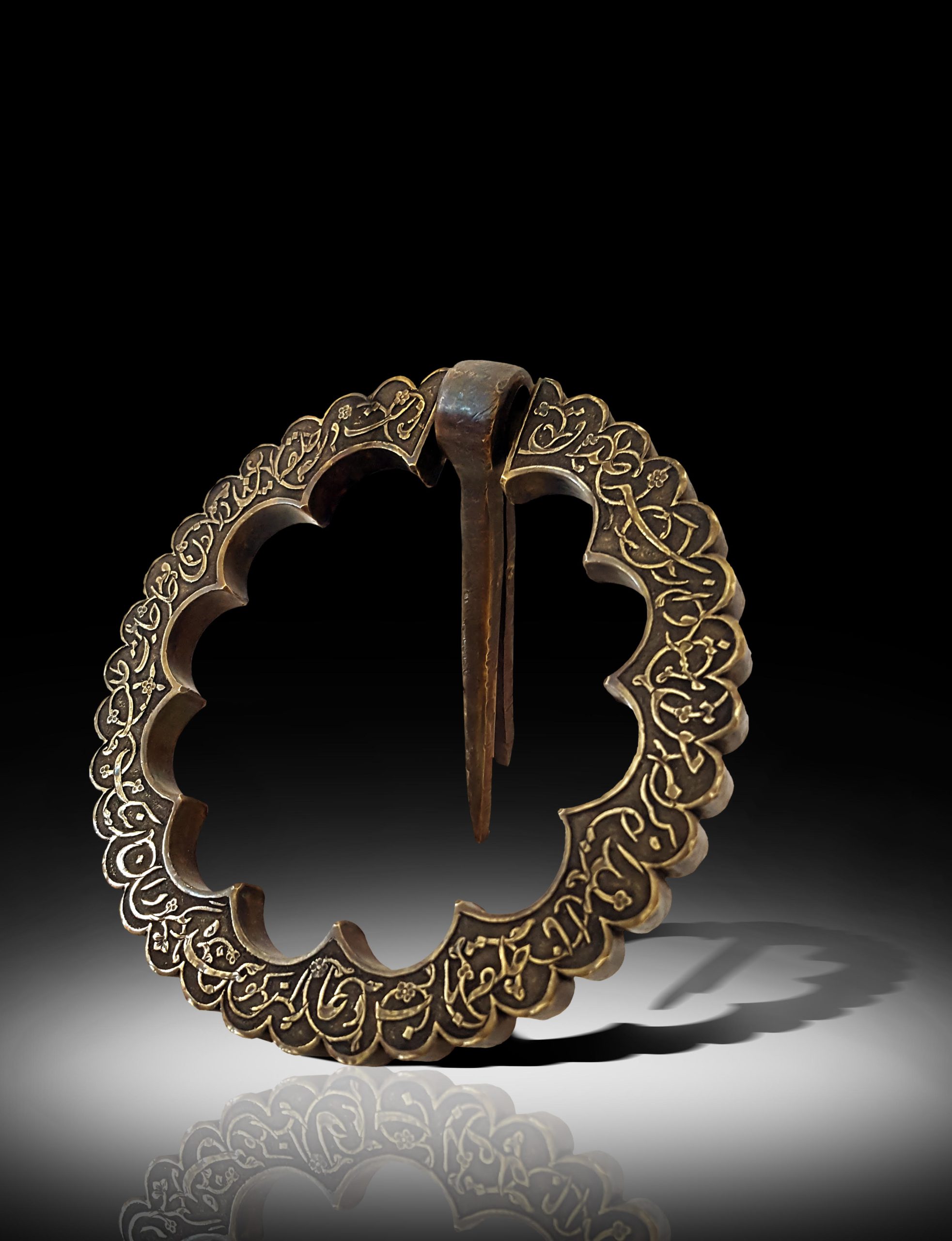 IN A STYLE OF SAFAVID ENGRAVED BRASS DOOR KNOCKER Hatefi collections